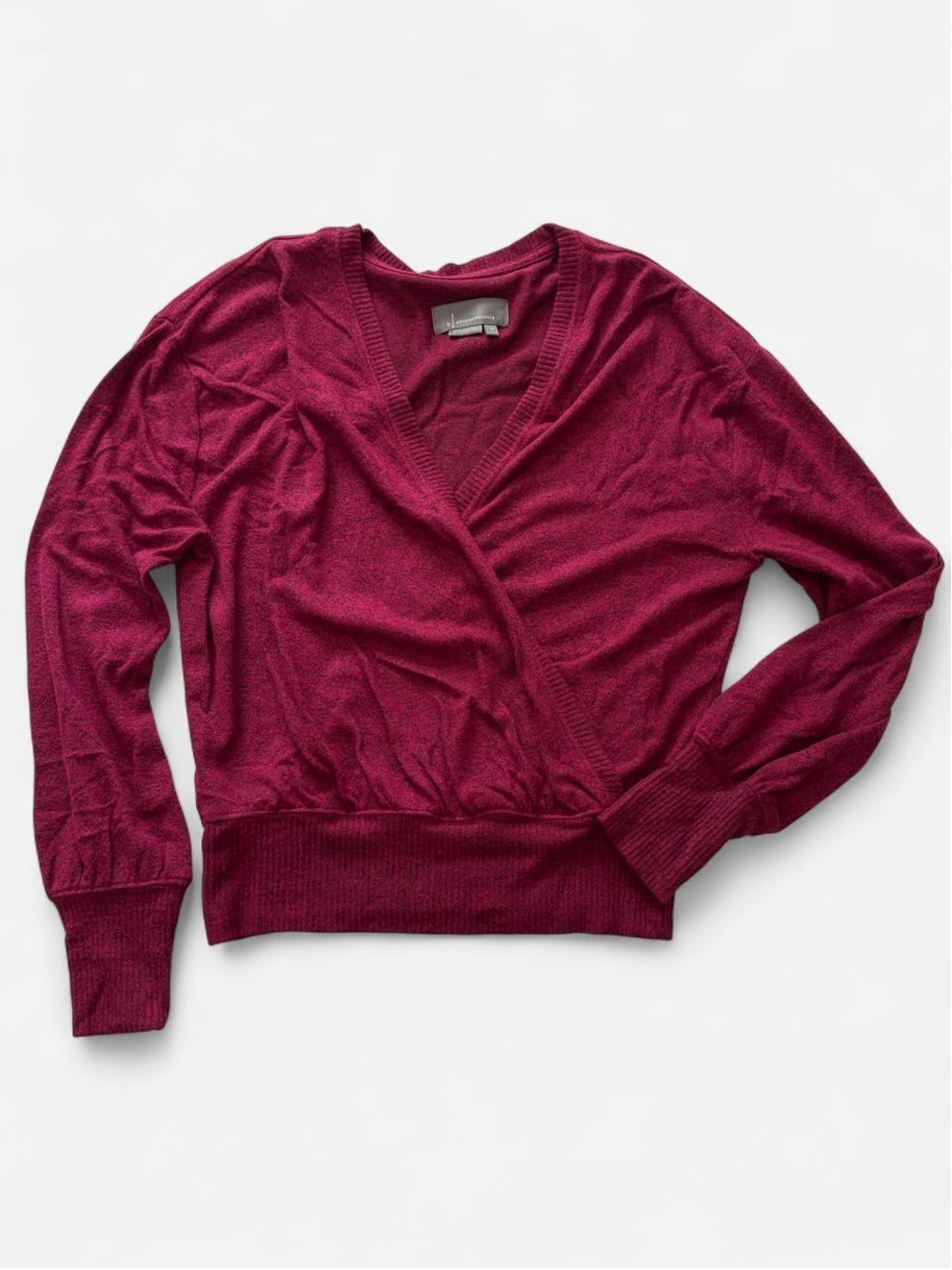 By Anthropologie burgundy/cranberry faux wrap knit top.